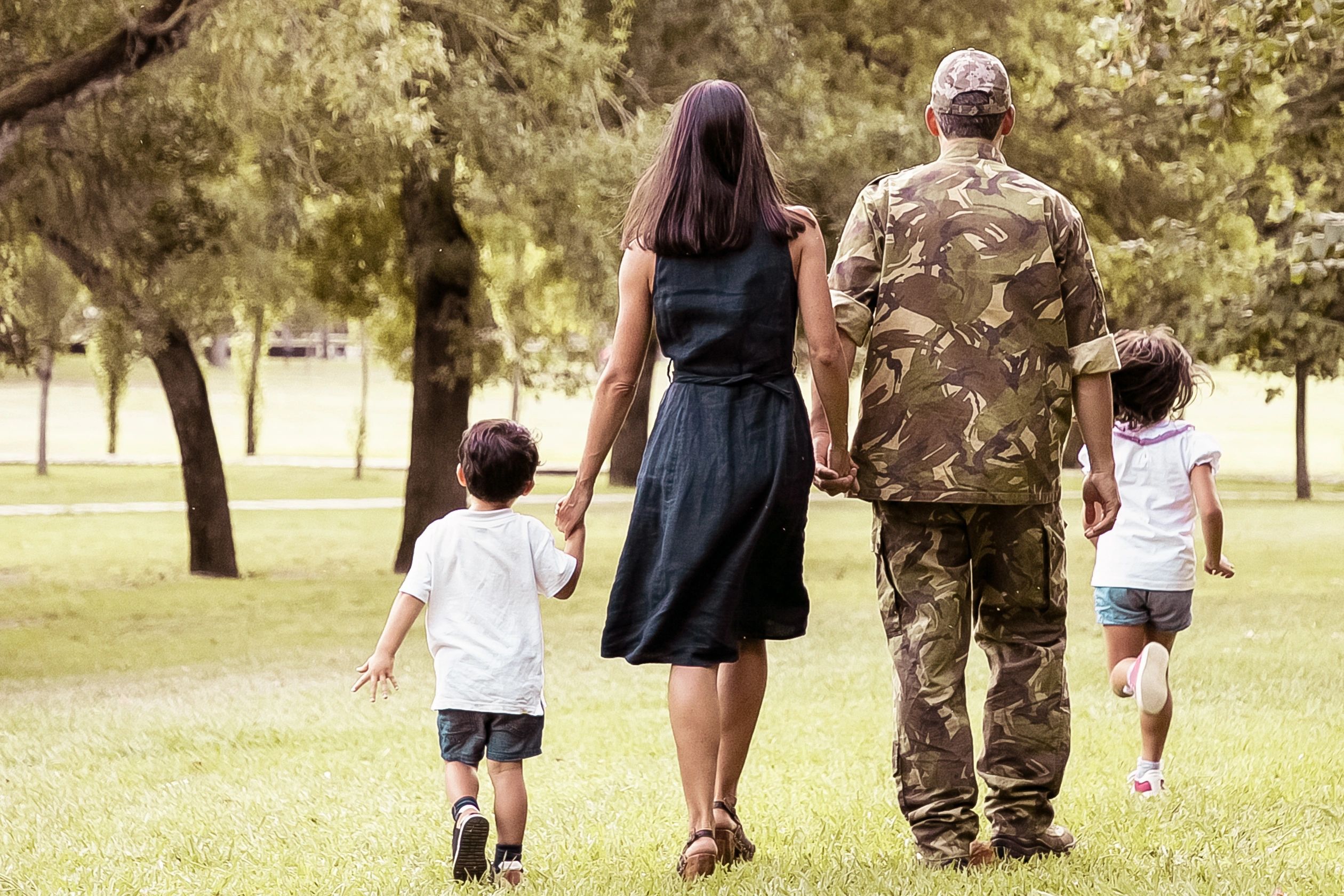 Military family walking together outdoors