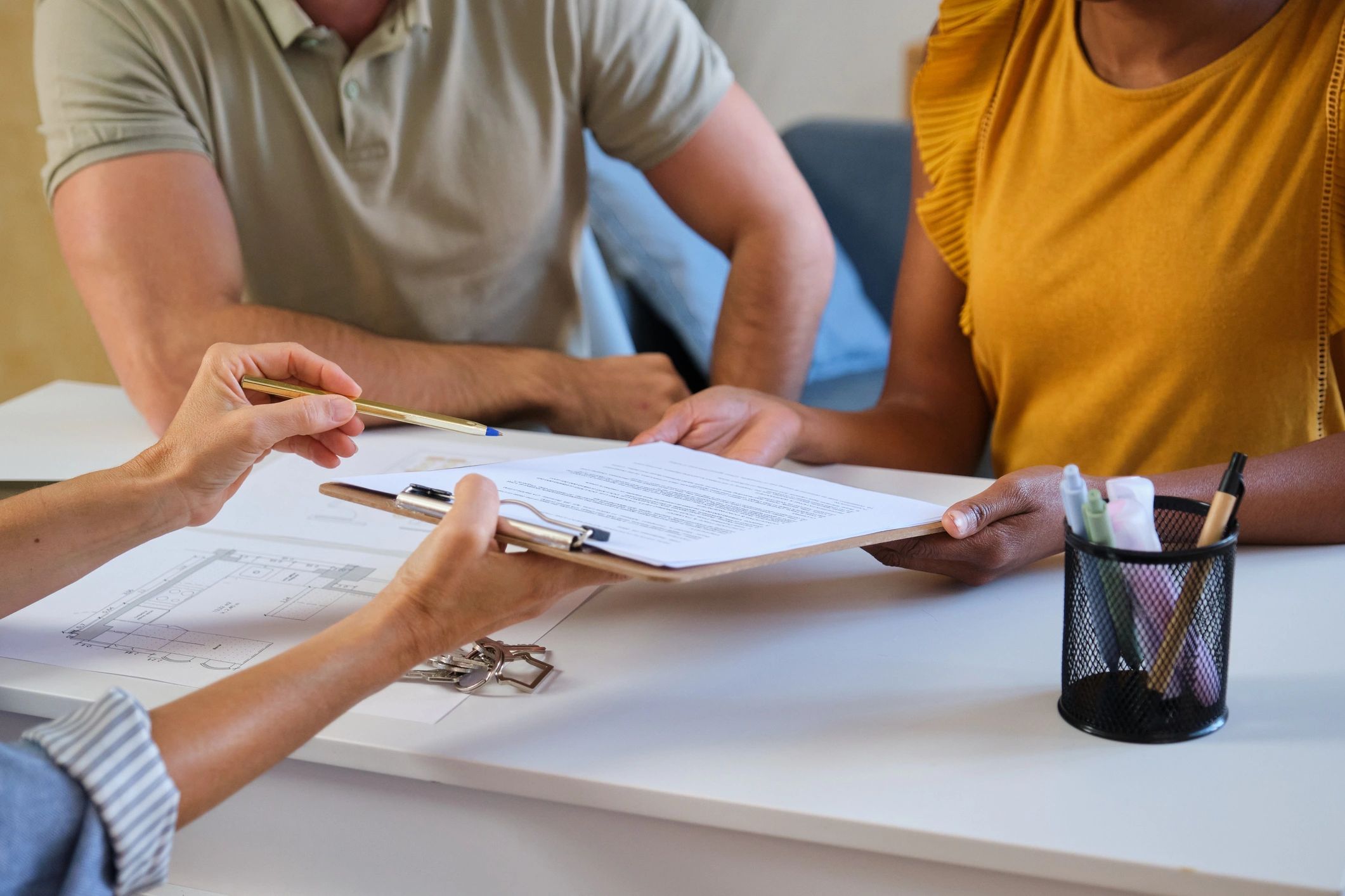 Clients reviewing real estate closing paperwork